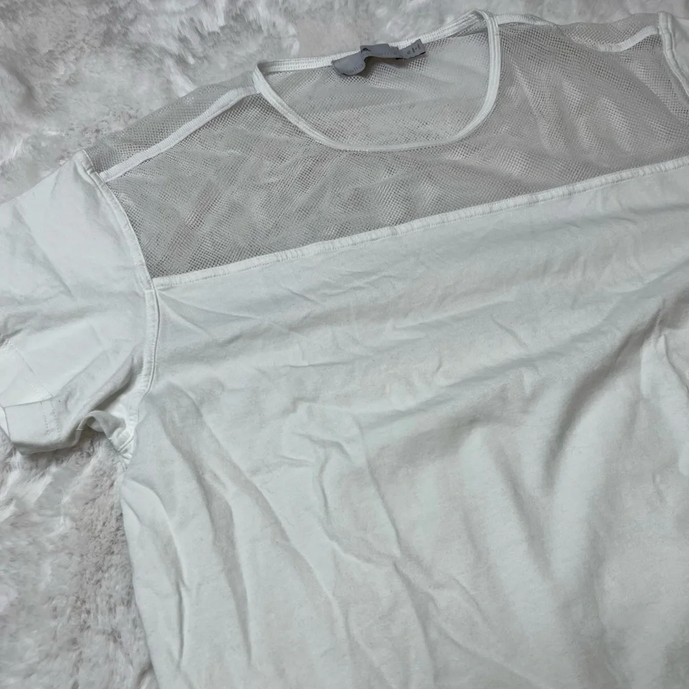 White adidas work out active shirt with mesh on the top and bottom. - Picture 2 of 8